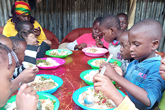 Children eating at smile community centre children's home