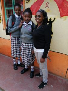 Our founder Margret with some high school girls supported by smile