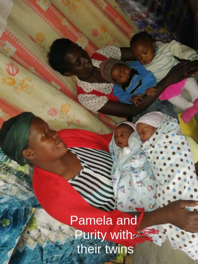 Pamela and Purity holding their twins